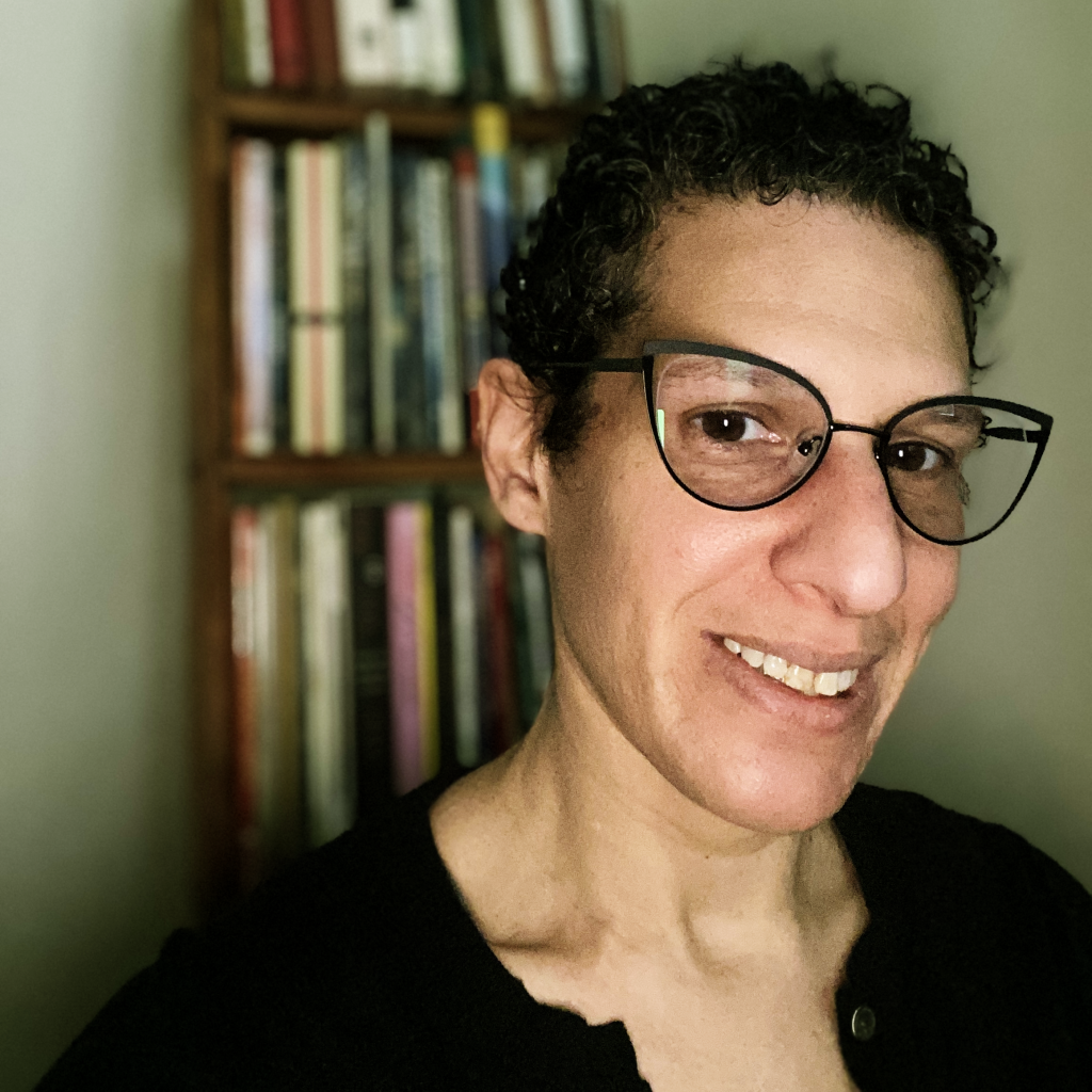 Woman with short hair and glasses