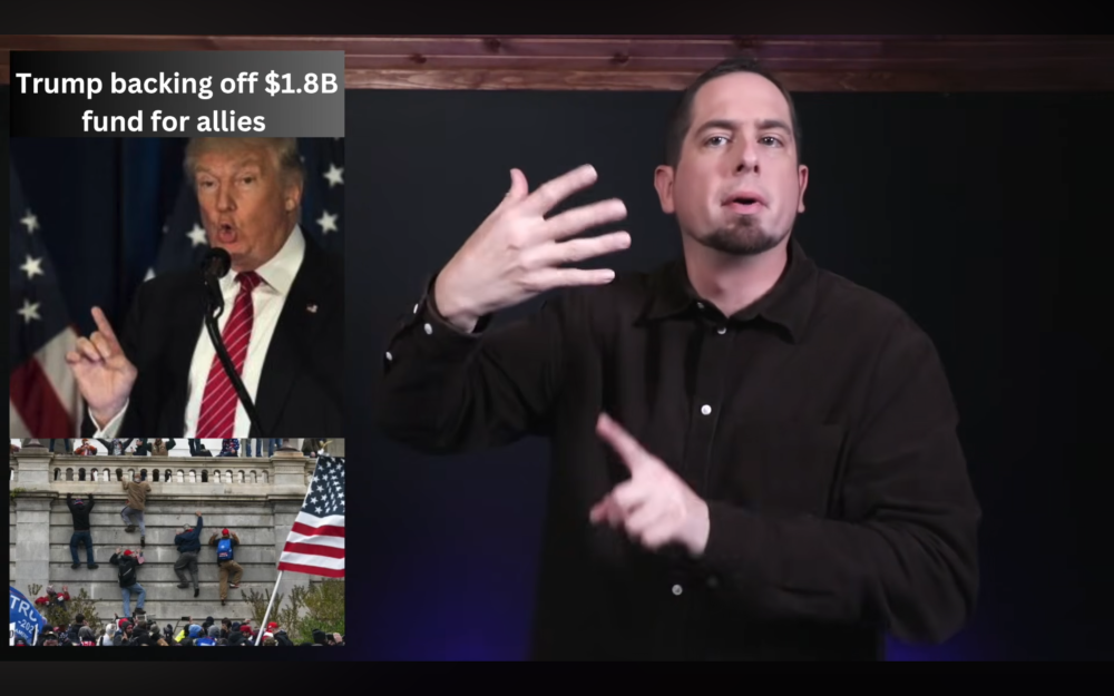 a man dressed in black against a black background signs the news with an image of President Donald Trump and Jan. 6 rioters to the left labled Trump backing off $1.8B fund for allies